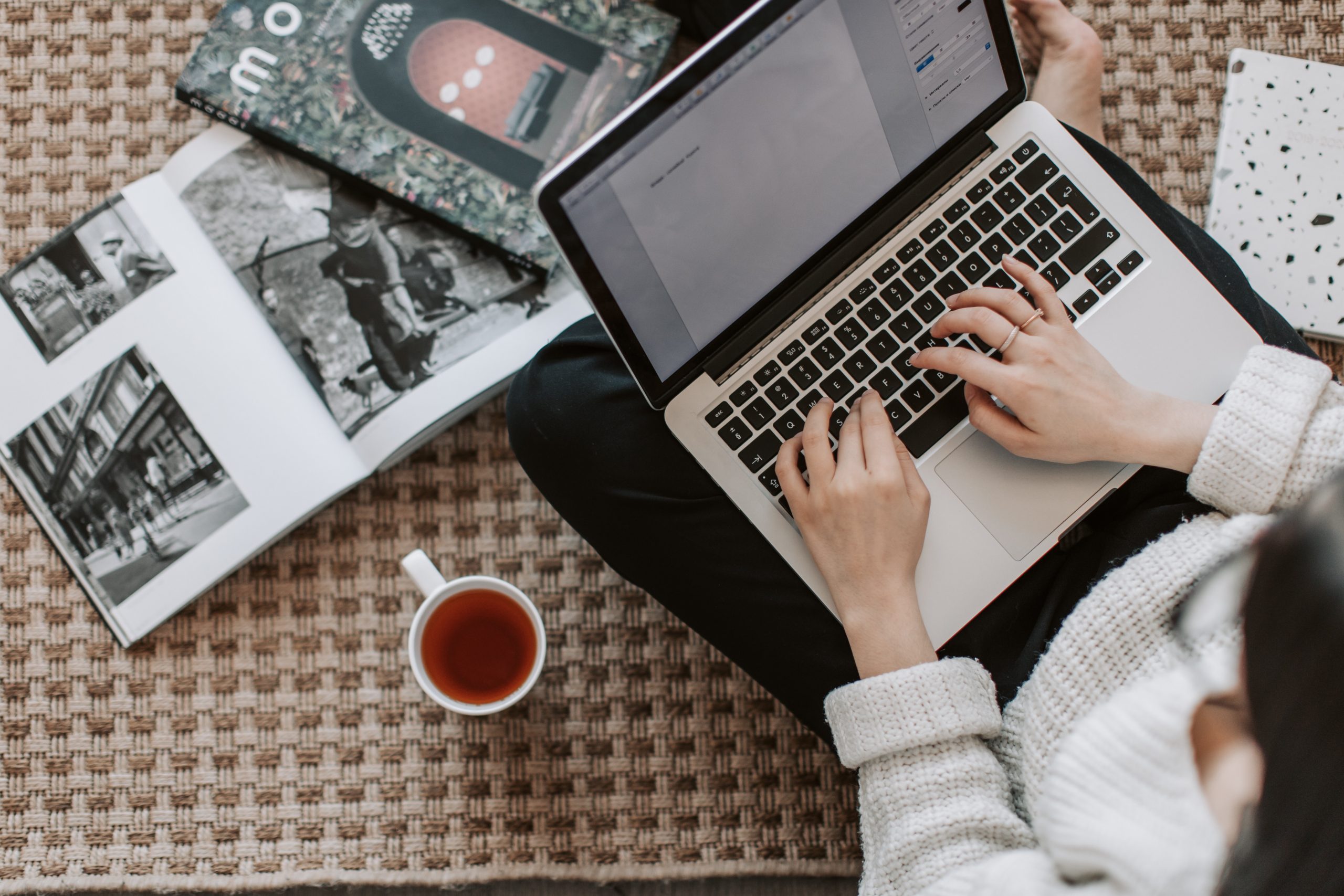 Woman writing on a laptop